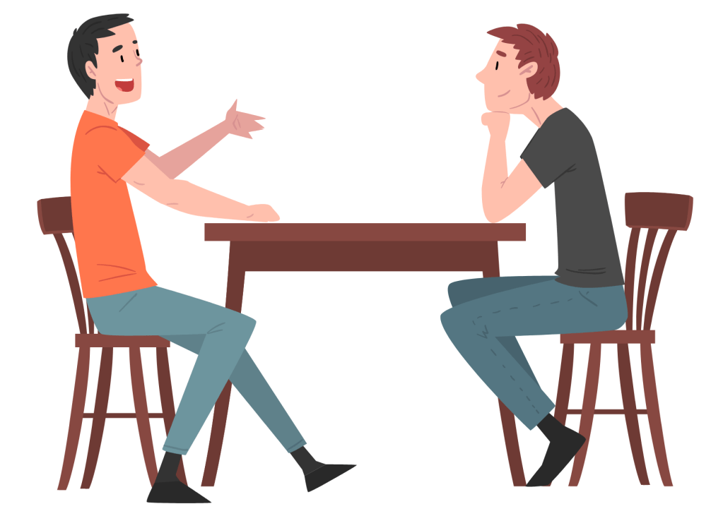 Two people at a coffee table